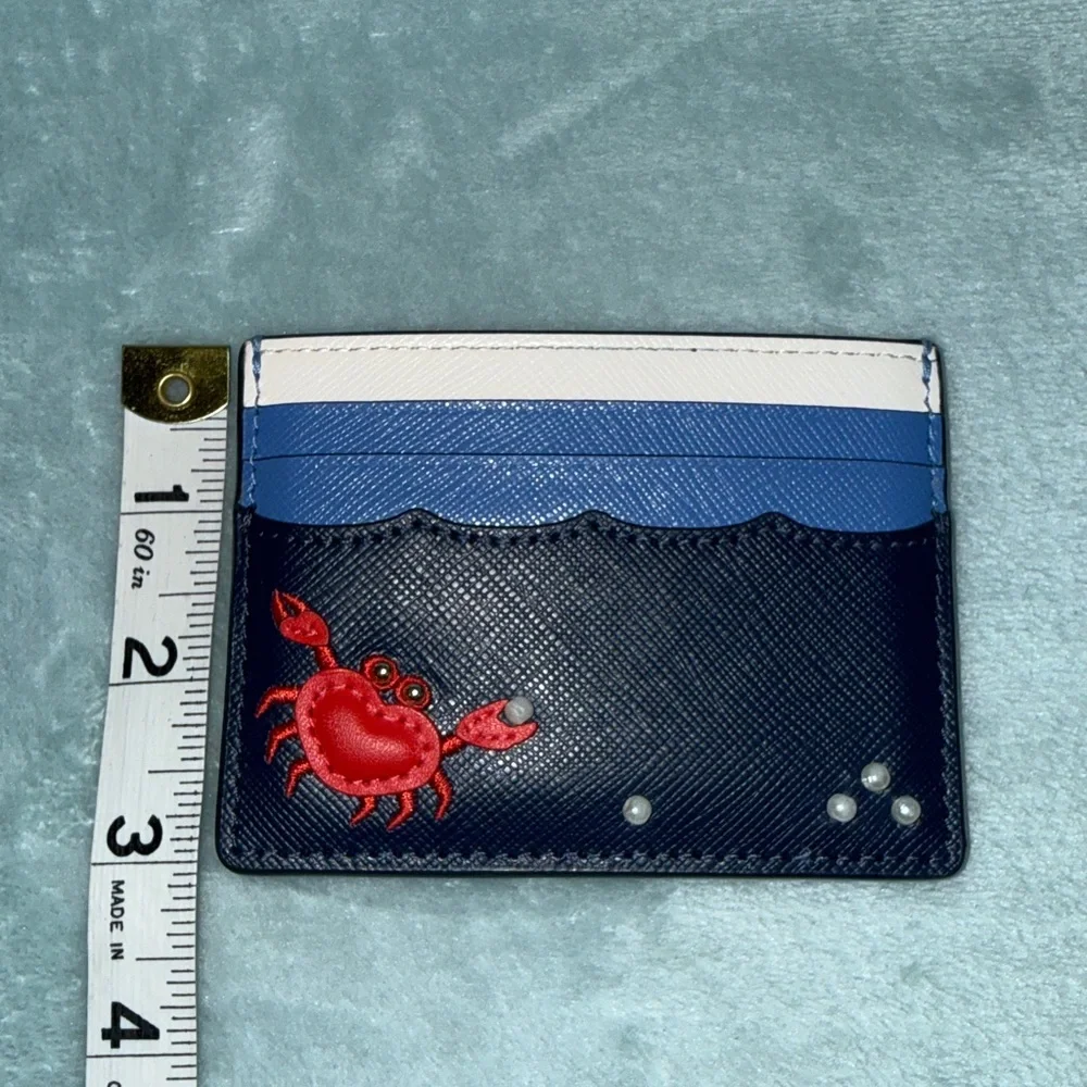 kate spade New York Pinch Me Crab Pearl Beach Blue small slim card holder.
